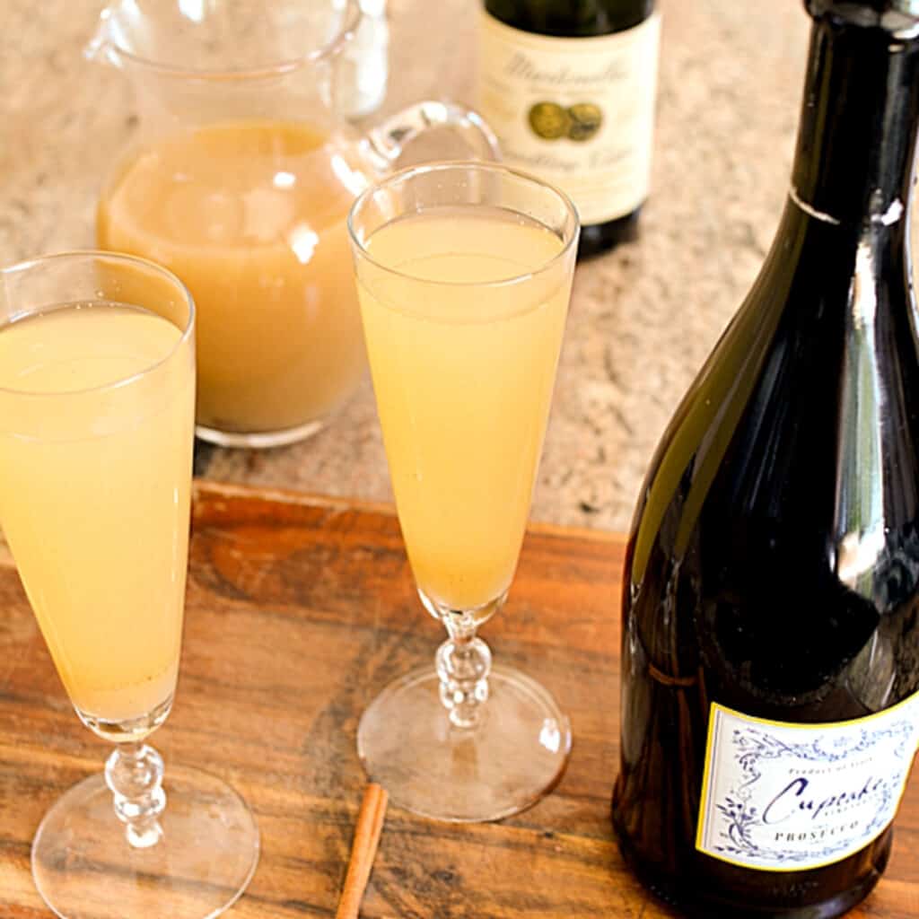 A close up of a bottle and a glass of wine, with Bellini and Pear