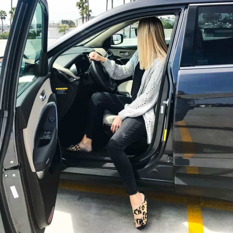 A mother waiting in her car for the kids.