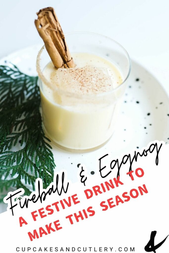 Text: Fireball and Eggnog, a festive drink to make this season with a cup on a table with ice and a cinnamon stick.