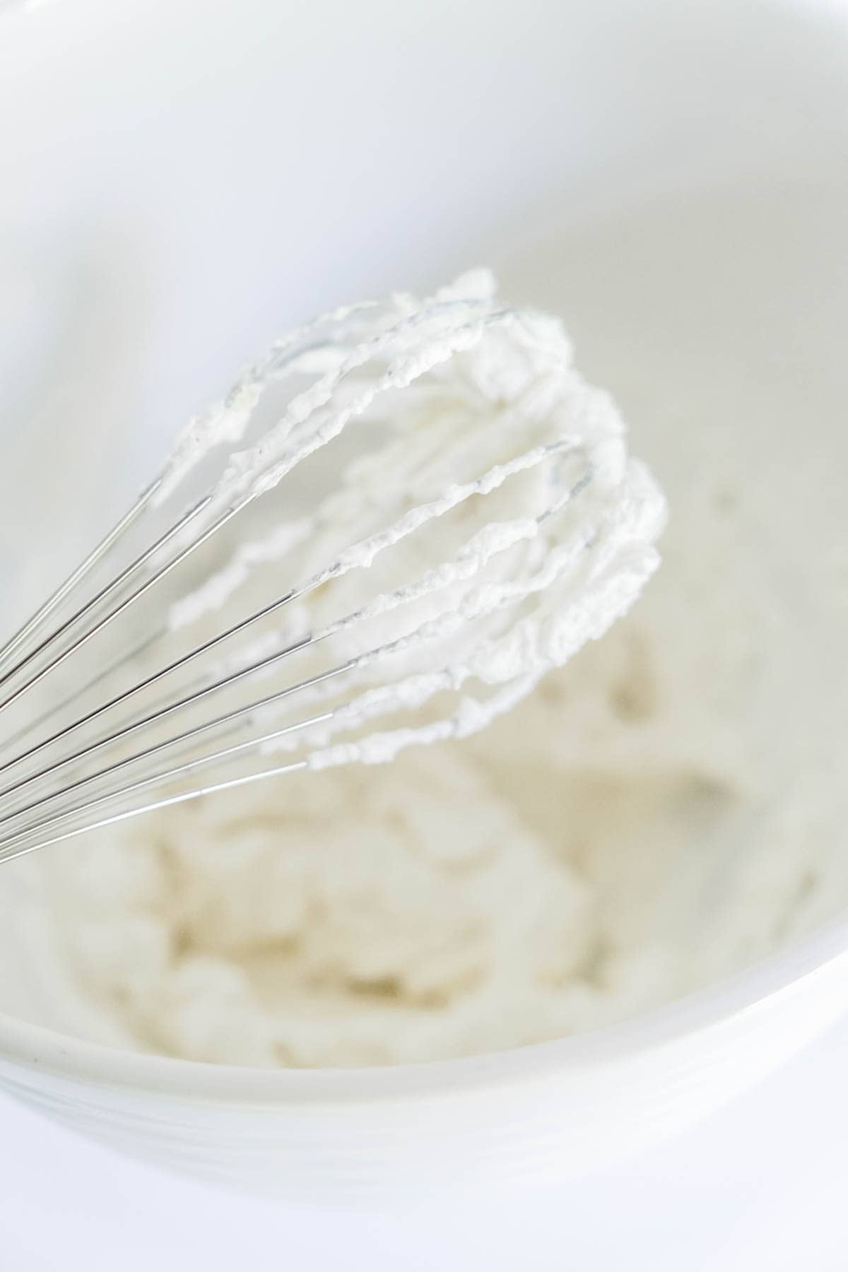 Whisk used to make homemade whipped cream for mini trifles.